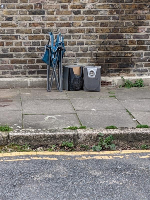 Stuff dumped on pavement. This is a regular spot. Can we have a camera here?-9 Martha Road, Stratford, London, E15 4NP