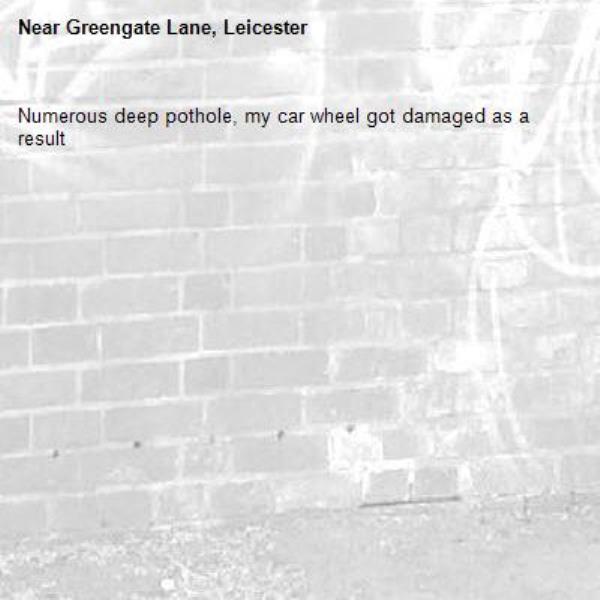 Numerous deep pothole, my car wheel got damaged as a result -Greengate Lane, Leicester