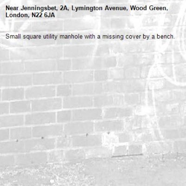 Small square utility manhole with a missing cover by a bench.-Jenningsbet, 2A, Lymington Avenue, Wood Green, London, N22 6JA