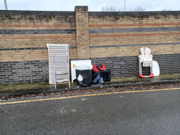 Tyres, step ladder, mattress, bags ,suitcase. Planks and baby chair fly tipped opposite 52 Ridgwell Road, E16. -52 Ridgwell Road, West Beckton, London, E16 3LN