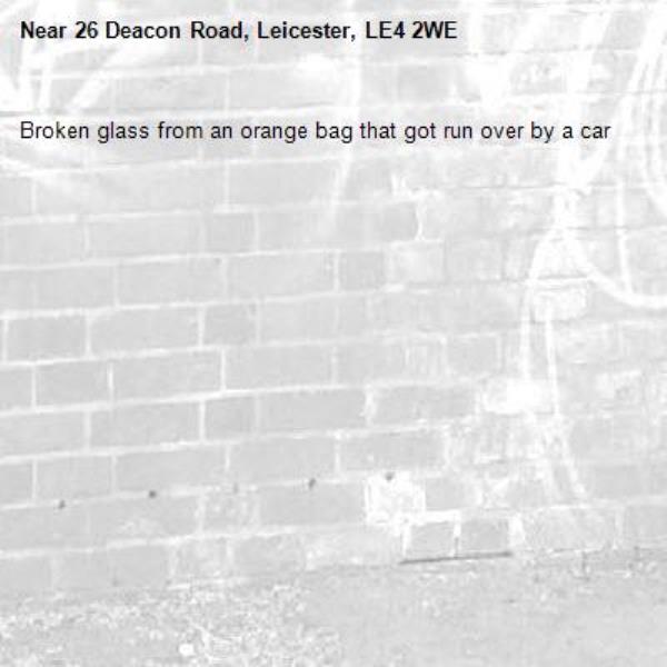 Broken glass from an orange bag that got run over by a car-26 Deacon Road, Leicester, LE4 2WE