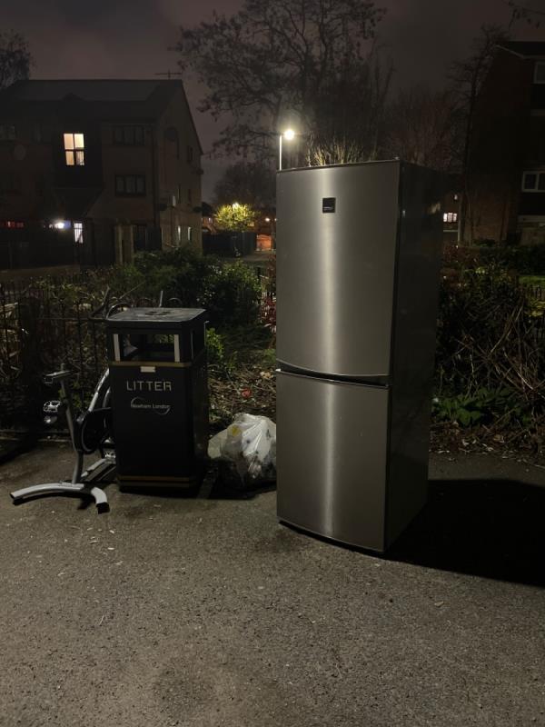 Someone left a fridge and some exercise equipment by the road -62 David Street, Stratford, London, E15 1PP