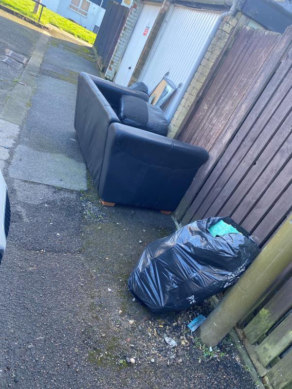 A leather sofa and a black bag of carpet underlay has been dumped outside my house blocking my back gate. 
There is a camera on the lamp post outside my house which will of seen whoever has done this.-187 Cuffling Drive, Leicester, LE3 6PD