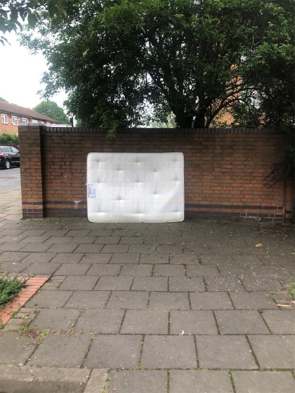 Mattress left by wall next to 34 Avondale Court -23 Liverpool Road, Canning Town, London, E16 4LU