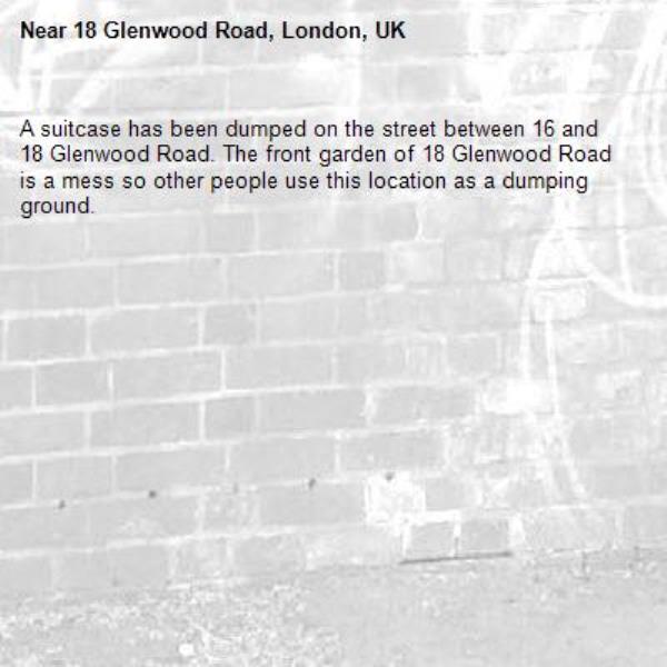 A suitcase has been dumped on the street between 16 and 18 Glenwood Road. The front garden of 18 Glenwood Road is a mess so other people use this location as a dumping ground.-18 Glenwood Road, London, UK