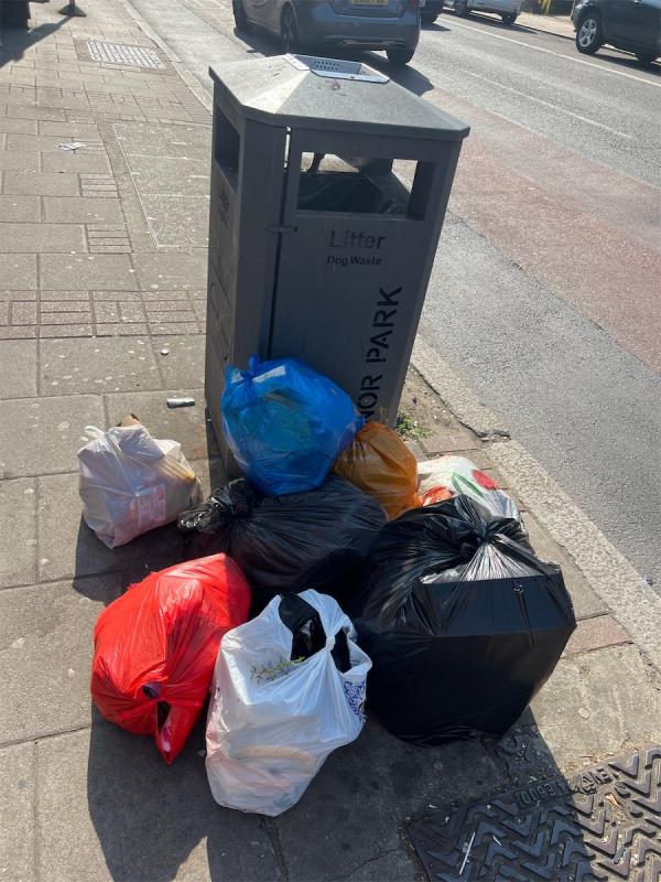 Overflowing rubbish bin-542 Romford Road, Forest Gate, London, E7 8AF