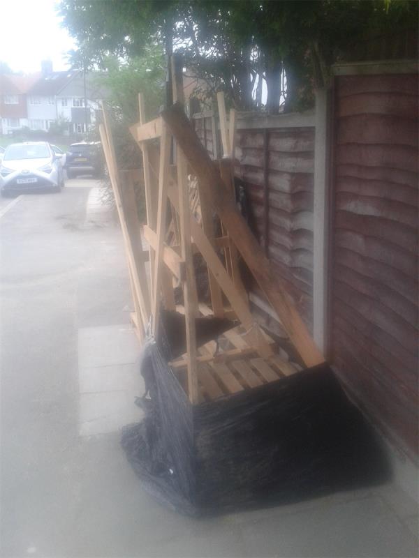 Please clear wooden structure from. Pavement-113 Bramdean Crescent, London, SE12 0UJ