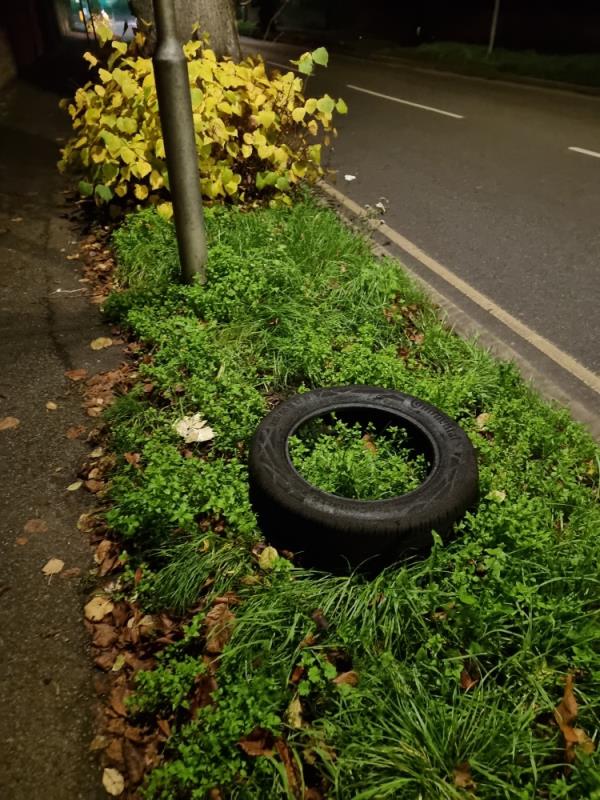 Tyre discarded on verge.-17 Coley Avenue, RG1 6LJ, England, United Kingdom