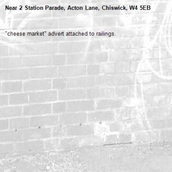 "cheese market" advert attached to railings. -2 Station Parade, Acton Lane, Chiswick, W4 5EB