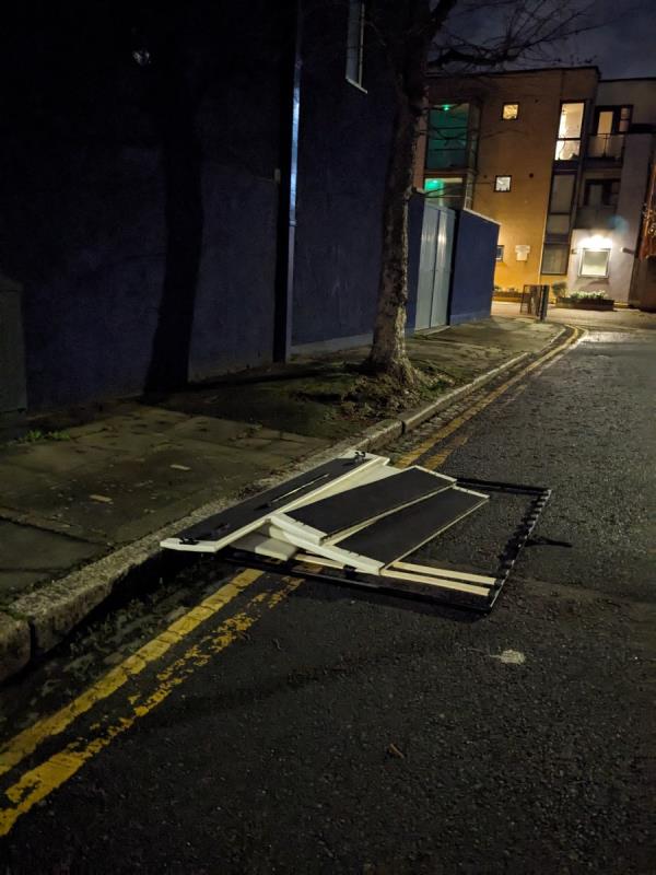 Someone's dumped pieces of a bed in the gutter at the top of Louise Rd, E15-72 Louise Road, Stratford, London, E15 4NW