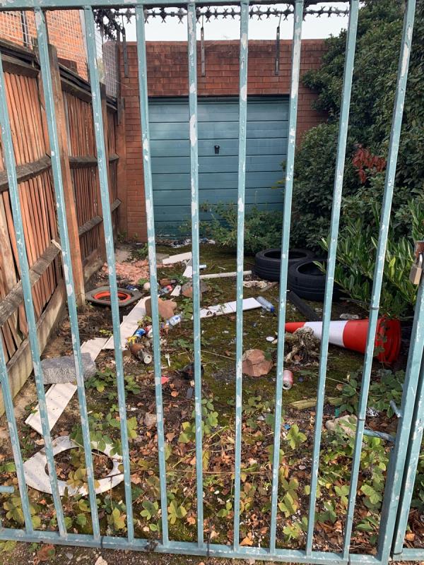 Good morning, There’s an assortment of tipped rubbish, in plain view and a suitcase, laundry bin etc in the bushes. I’ve cleared what I can reach, but that’s only a metre in I’m afraid.-25 Arnesby Crescent, Leicester, LE2 6QZ