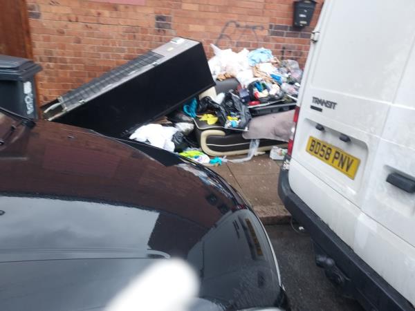 Rubbish in 2 piles covering the pavement , including fridge freezer -2 Mountcastle Road, Westcotes, LE3 2BW, England, United Kingdom