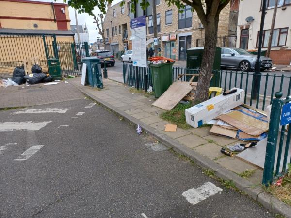 Cardboard boxes, wooden boards, plastics and items of clothing fly tipped inside Shaftesbury Road car park, E7.-88 Shaftesbury Road, Forest Gate, London, E7 8PD