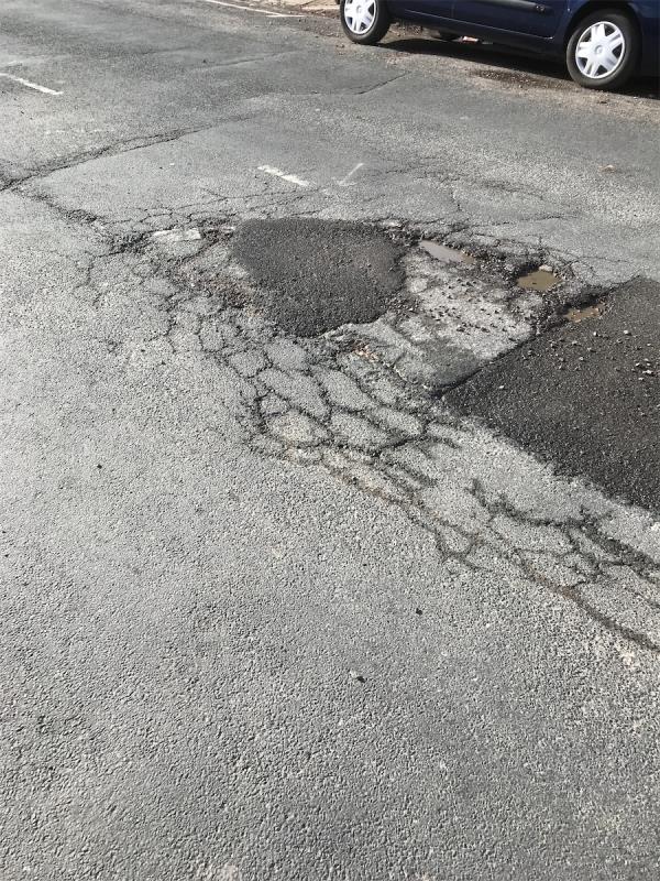 How many times does this pothole needs reporting as you can see from the picture how many times the job has NOT been done not correctly-9 Stoughton Drive North, Leicester, LE5 5UD