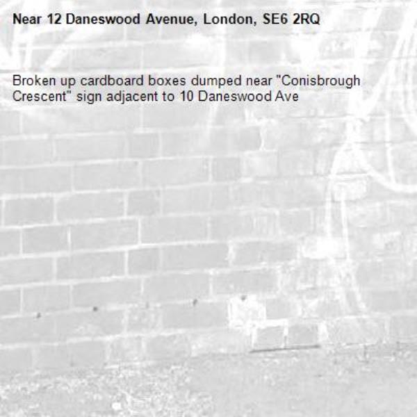 Broken up cardboard boxes dumped near "Conisbrough Crescent" sign adjacent to 10 Daneswood Ave-12 Daneswood Avenue, London, SE6 2RQ