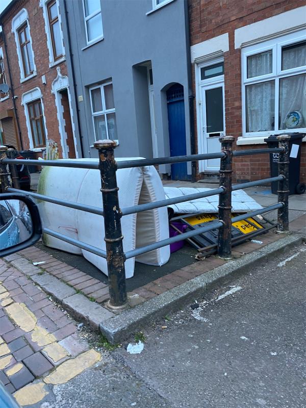 Household furniture and road signs dumped in street.-16 Bartholomew Street, Leicester, LE2 1FA