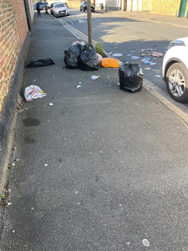 Rubbish dumped by roadside. Please note second photo with name and address from where this rubbish likely came from. These people that consider dumping their crap on the streets is ok need to be spoken to and fined!!-Basil Avenue, East Ham, London