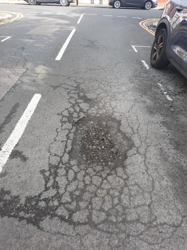 The tarmac on Vernon road (in front of number 24-22) is seriously damaged. It is now a big pothole with numerous debris that are dangerous to passerby and vehicles parked on the road-N8 0qd