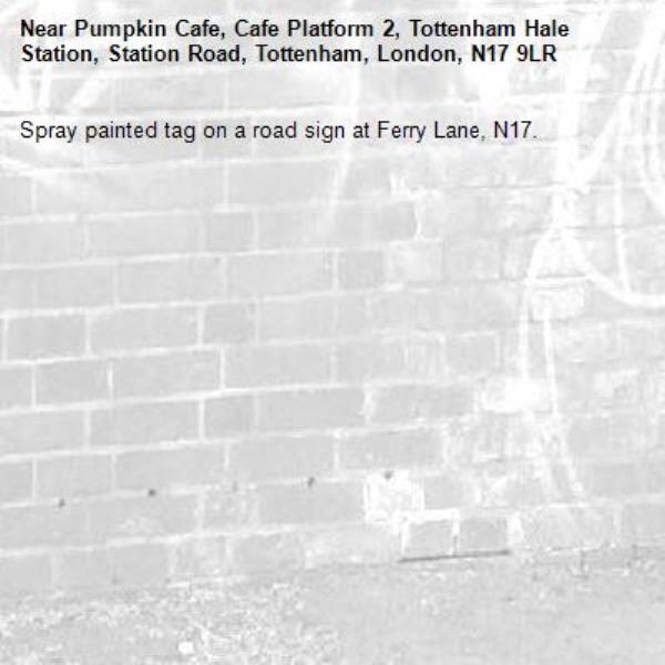 Spray painted tag on a road sign at Ferry Lane, N17.-Pumpkin Cafe, Cafe Platform 2, Tottenham Hale Station, Station Road, Tottenham, London, N17 9LR