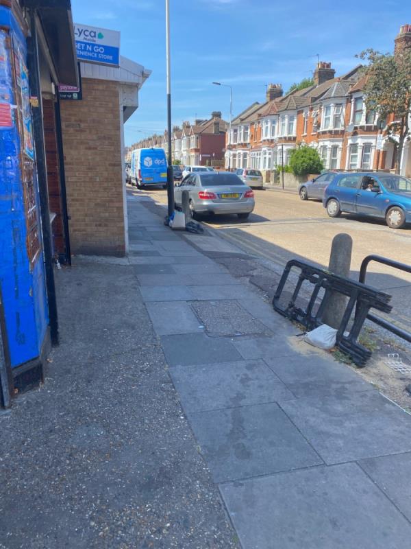 Bags of rubbish outside shops and a plastic gate and sand bag that’s been here for two years in Burges road. Please take away-185 Altmore Avenue, East Ham, E6 2BT