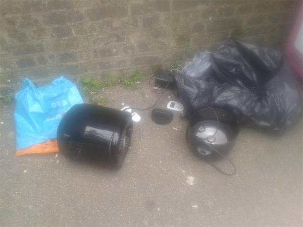 Please clear flytip electrical items from side of Electrical bank-Kinley Folkard And Hayard, 1 Station Approach, Burnt Ash Hill, London, SE12 0AB