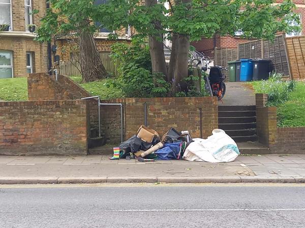 Numerous bags of discarded materials, and loose items are blocking the footpath between 202 and 200 Kirkdale.-Flat A, 202 Kirkdale, London, SE26 4NL