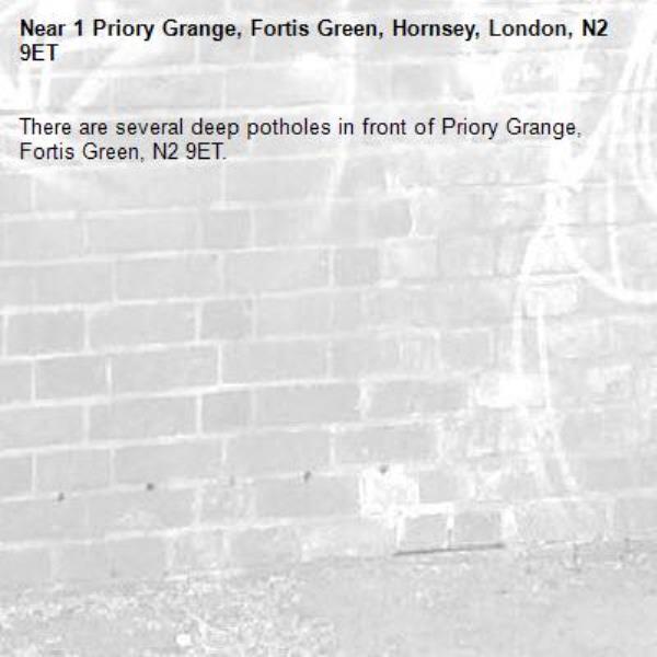 There are several deep potholes in front of Priory Grange, Fortis Green, N2 9ET.-1 Priory Grange, Fortis Green, Hornsey, London, N2 9ET