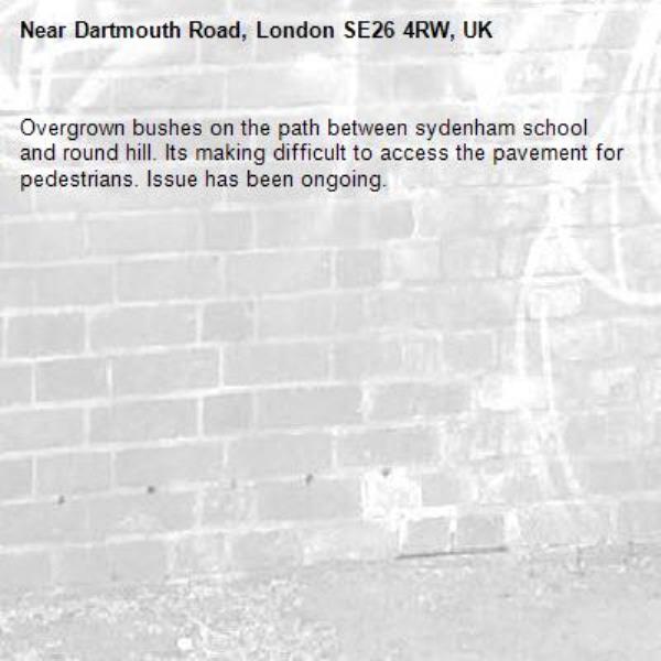Overgrown bushes on the path between sydenham school and round hill. Its making difficult to access the pavement for pedestrians. Issue has been ongoing.-Dartmouth Road, London SE26 4RW, UK