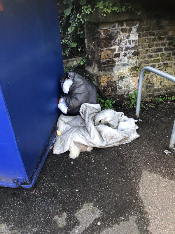 Side of Recycling banks. Please clear flytip of clothing-1 Glenmere Row, London, SE12 8RH