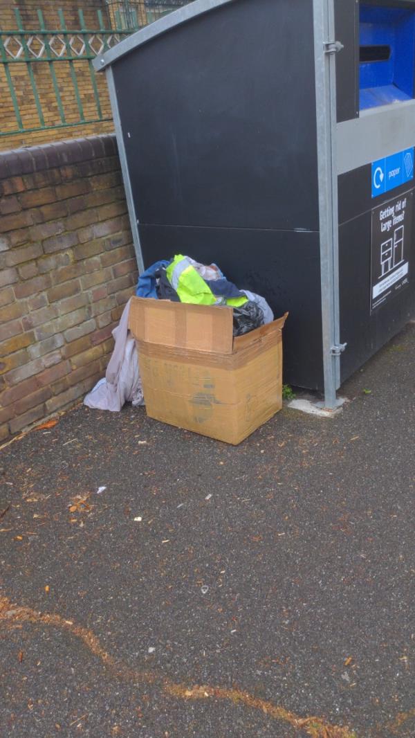Rubbish/clothes dumped alongside the recycling bins between Arragon Rd and St Bernards Rd opposite the Boleyn medical centre in Barking Rd -Boleyn Medical Centre, 152 Barking Road, East Ham, London, E6 3BD