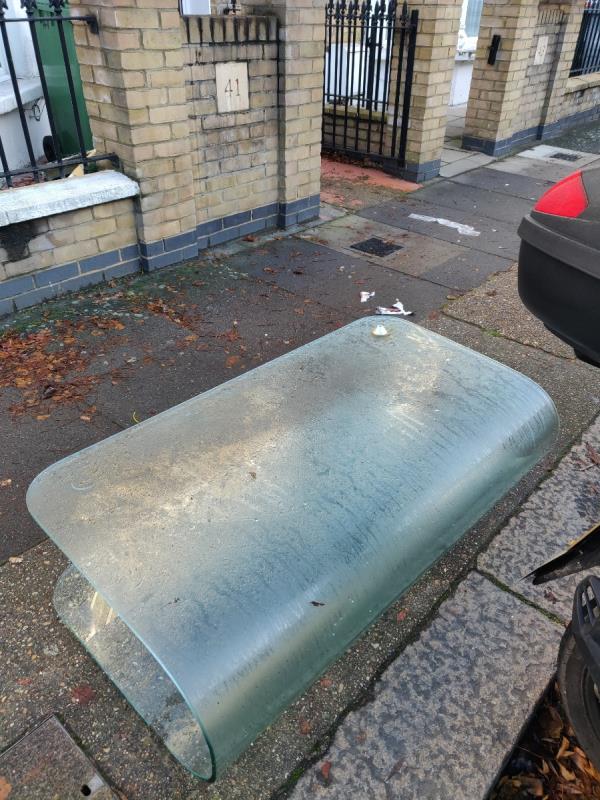 Glass coffee table dumped outside 41 Kitchener Road -41 Kitchener Road, Forest Gate, London, E7 8JN