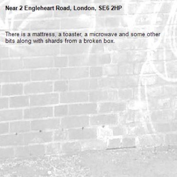 There is a mattress, a toaster, a microwave and some other bits along with shards from a broken box. -2 Engleheart Road, London, SE6 2HP