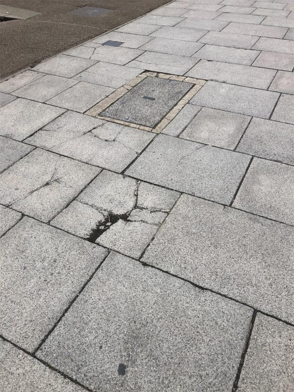 Broken uneven paving stones due to drivers driving vehicles over pedestrian pavement. Can repairs be charged back to commercial vehicle owners most often parked here?-The Gantry Hotel, 40 Celebration Avenue, Stratford, London, E20 1DB