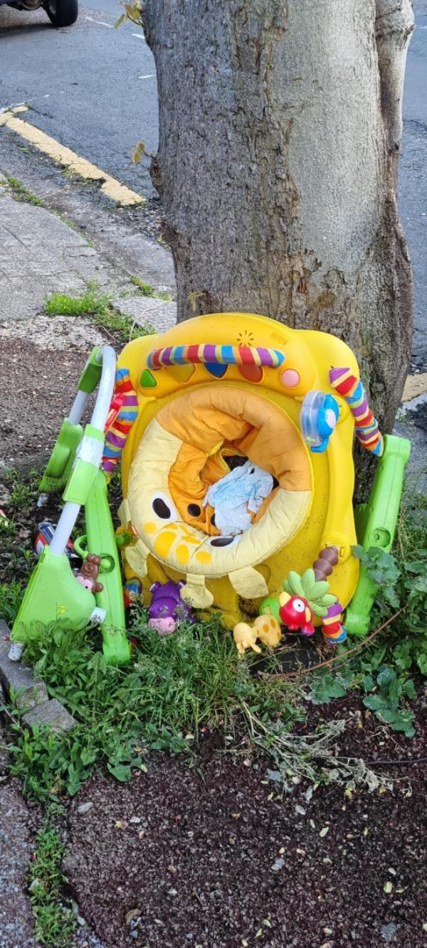 Baby play chair with nappy by a tree on the pavement -46 Woodhouse Grove, Manor Park, London, E12 6SR