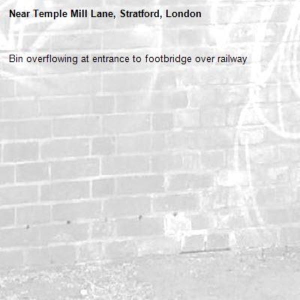 Bin overflowing at entrance to footbridge over railway -Temple Mill Lane, Stratford, London