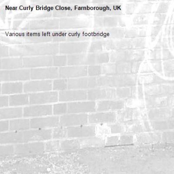 Various items left under curly footbridge -Curly Bridge Close, Farnborough, UK