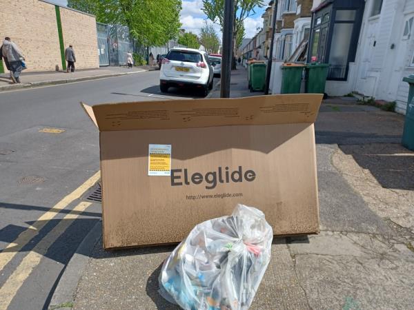 Cardboard box fly tipped at 74 Upton Park Road, E7. -74 Upton Park Road, Forest Gate, London, E7 8LD