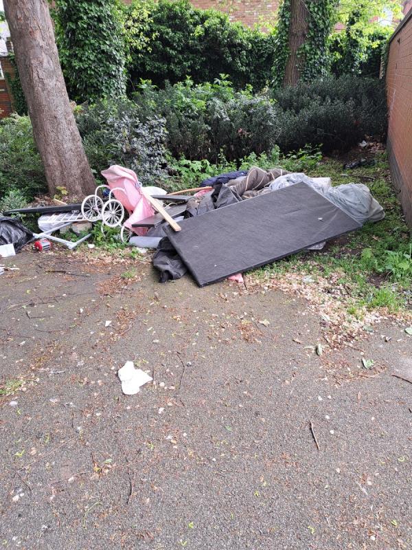 At the entrance to Cossington Park there are some recycling facilities.  The rubbish has been dumped next to them.-28 Brandon Street, Leicester, LE4 6AW