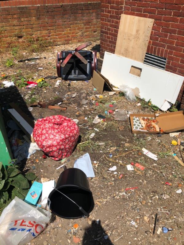 Various items on ground near bottle bank -2 Huntley Court, Reading, RG1 5NW
