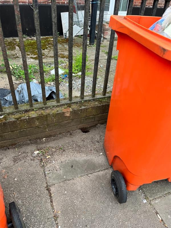 There is an increasing rate of issue around this area. The bins are not contained and the pavements are about to fall in because of their warren of holes. -402 Narborough Road, Leicester, LE3 2FR