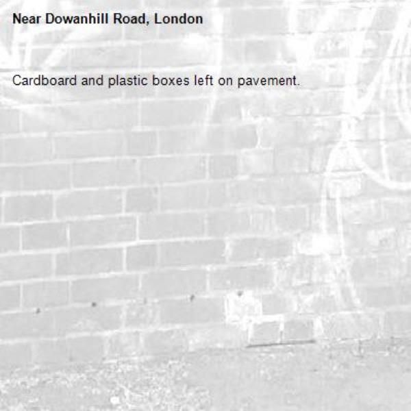 Cardboard and plastic boxes left on pavement.-Dowanhill Road, London