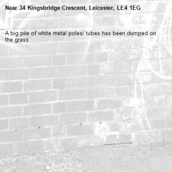 A big pile of white metal poles/ tubes has been dumped on the grass-34 Kingsbridge Crescent, Leicester, LE4 1EG
