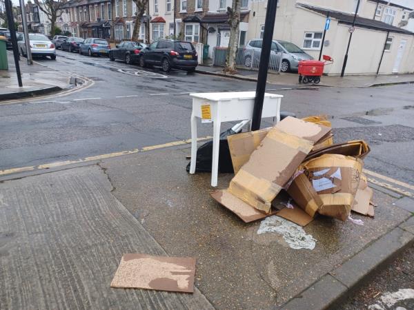Cardboard boxes, wooden furniture and household waste fly tipped at 60 St Antonys Road, E7. -60 St Antonys Road, Forest Gate, London, E7 9QB