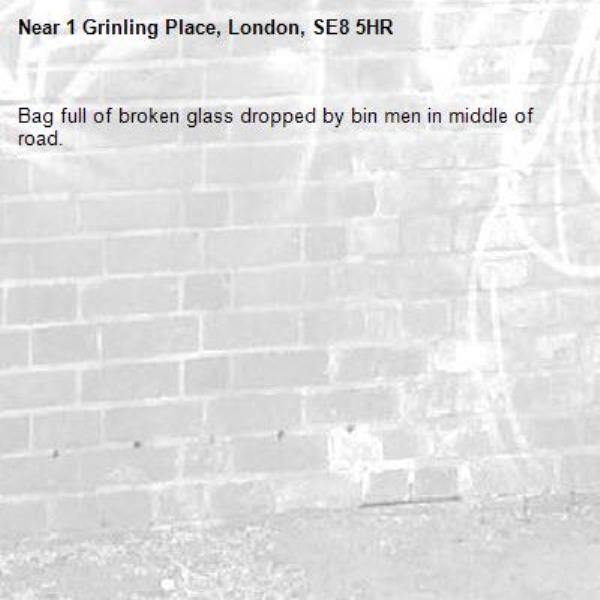 Bag full of broken glass dropped by bin men in middle of road.-1 Grinling Place, London, SE8 5HR