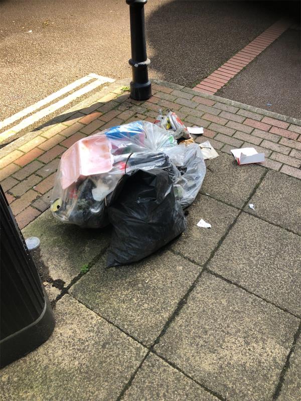 Please clear dumped bags from beside Litter bin outside no 1-Farrer House, Deptford Church Street, London, SE8 3DY