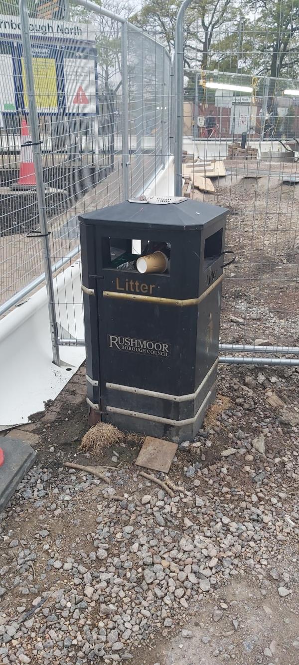 Full litter bin at Farnborough North Station just over foot crossing.-The Hatches, Farnborough