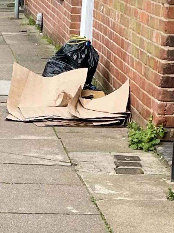 Cardboard and bag of rubbish left on pavement a week now hoped it might get bagged up for bin day last Friday but it didn’t -Ridley Street, Leicester