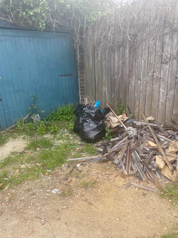 Crap dumped by garages near Kensington primary school-99 Kensington Avenue, Manor Park, London, E12 6NL