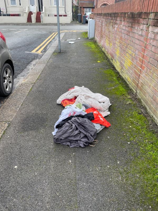 Piles of clothes etc dumped on pavement  -1 Ormsby Street, Reading, RG1 7YR