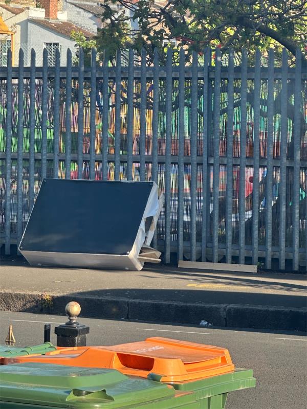 Bed dumped outside primary school blocking pavement -46 Buxton Road, Stratford, London, E15 1QU